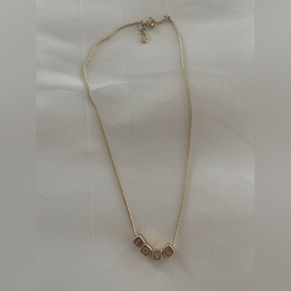 Woman’s “LOVE” block letters goldstone necklace from the LUCKY store NWOT